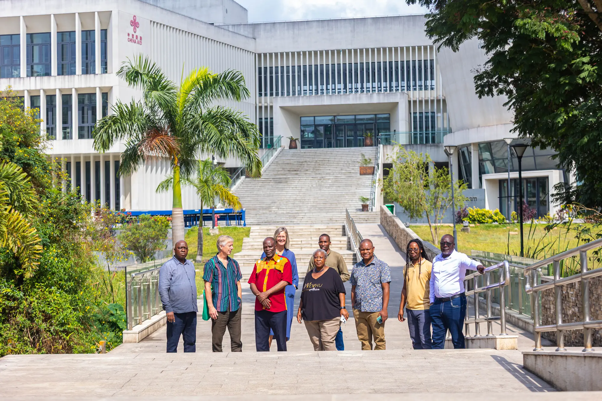 TANFWA members and guests lined up on the steps of the University of Dar es Salaam Library